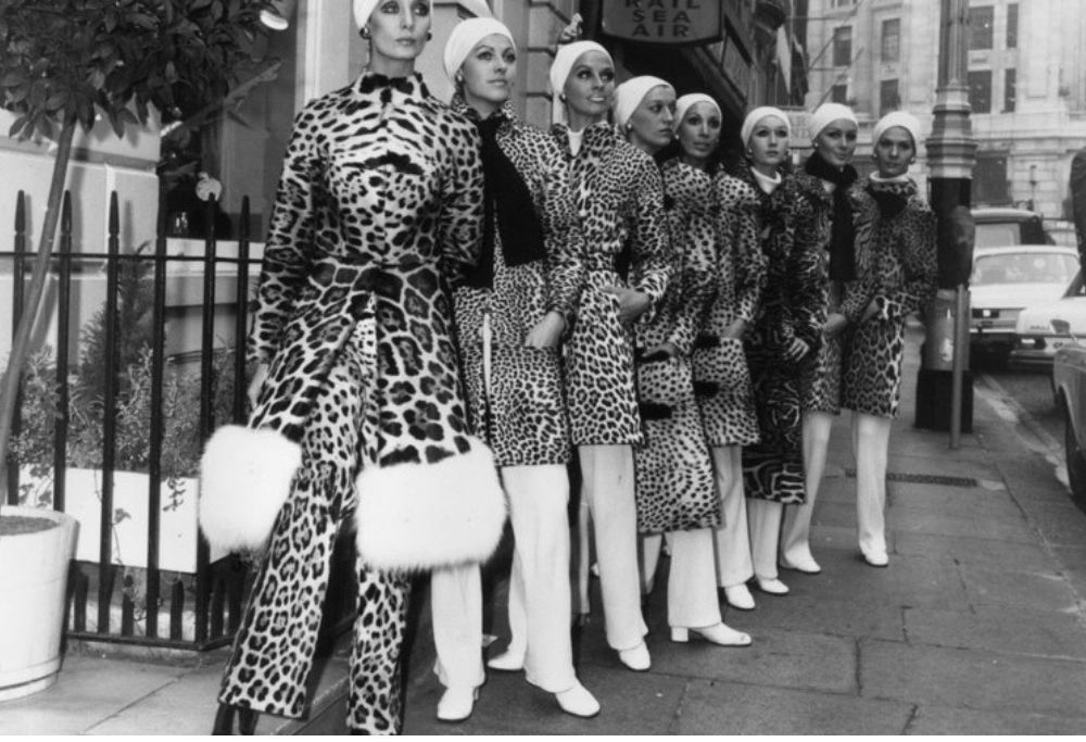 What is the history and origin of animal printed handbags in the fashion world?